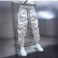 Close-up of light gray lightweight casual pants with adjustable drawstring waistband