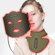 Woman using LED silicone facial mask for skin rejuvenation therapy