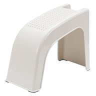 White plastic shower foot rest stand with non-slip perforated surface