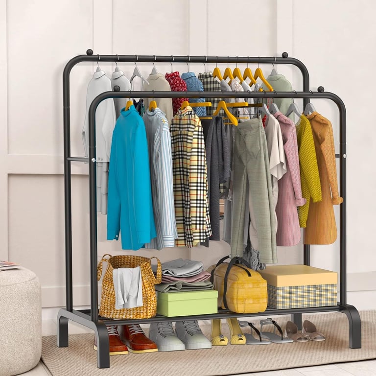 Freestanding double garment rack with retail-ready clothing display and accessories