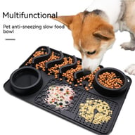 Dog eating kibble and treats from black silicone slow feeder mat