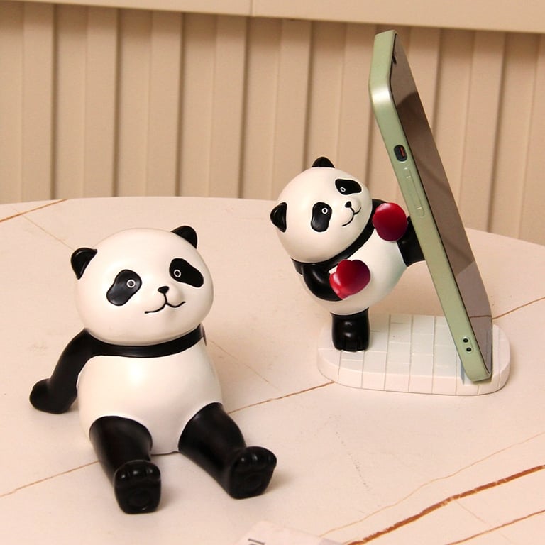 Panda phone holder close-up showing neat paint detail and sturdy resin base