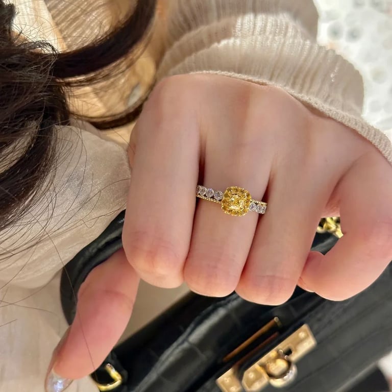 Yellow diamond sugar cube ring close-up showing gemstone detail and band