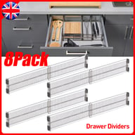 Eight drawer dividers organizing kitchen utensil drawer with forks and spoons