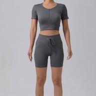 Teal women's quick-dry padded running bra and high-waisted ribbed shorts set