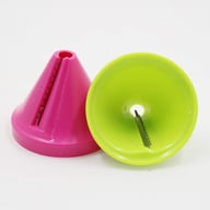 Two handheld spiralizer graters in pink and green colors side by side