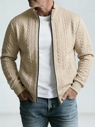 Black jacquard stand-neck jacket showing cable knit texture and quality stitching