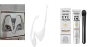 White eye massager glasses with USB charging cable and packaging box contents displayed