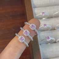 Three pink cushion cut CZ sterling silver rings on finger showing size and sparkle