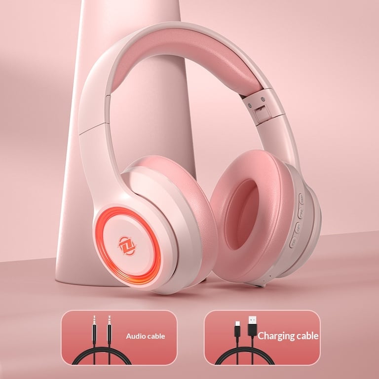 Pink wireless headphones with included audio and charging cables