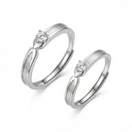 Close-up of adjustable 925 sterling silver couple rings with zirconia stones