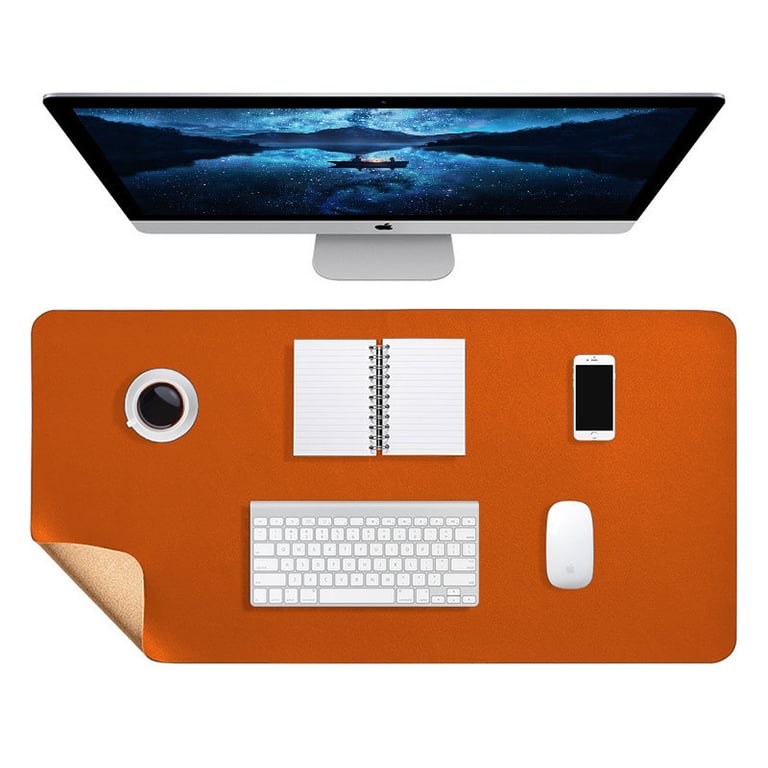 Orange leather desk mat showing durable stitching and reinforced edges