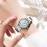 Woman wearing silver Curren Blanche ultra-thin rhinestone watch on wrist
