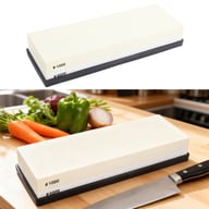 Dual grit wet sharpening stone with anti-slip base displayed in kitchen