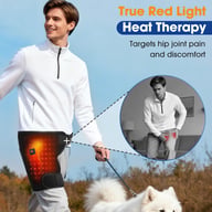 Man walking dog wearing 660nm red light therapy hip device outdoors