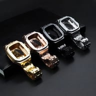 Four stainless steel smartwatch cases and bands in silver, gold, rose gold, and black metallic finishes
