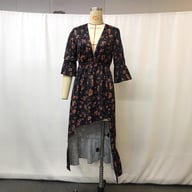 Front view of floral print bohemian maxi dress with V-neckline and bell sleeves