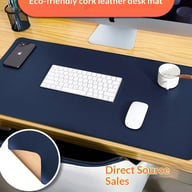 Navy blue waterproof leather mouse pad with keyboard, mouse, and phone on desk