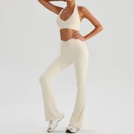 Beige halter bra and high-waisted flared leggings two-piece fitness outfit