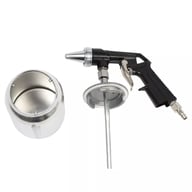 Disassembled handheld air sandblasting gun showing all components and media container