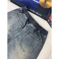 Back view of casual denim shorts showing elastic waistband and pockets