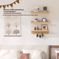 Wall-mounted wooden coat rack shelf with integrated hooks in bedroom storage setting