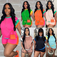 Woman wearing pink and orange loose-fitting two-piece short set with matching crossbody bag