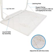 Man using foldable tray table on sofa for laptop work and dining
