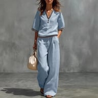 Woman wearing light blue cotton-linen V-neck shirt and wide-leg pants set