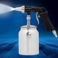 Air sandblasting gun with media blasting spraying action on surface