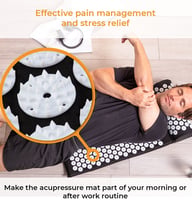 Man using acupressure mat for back and shoulder pain relief