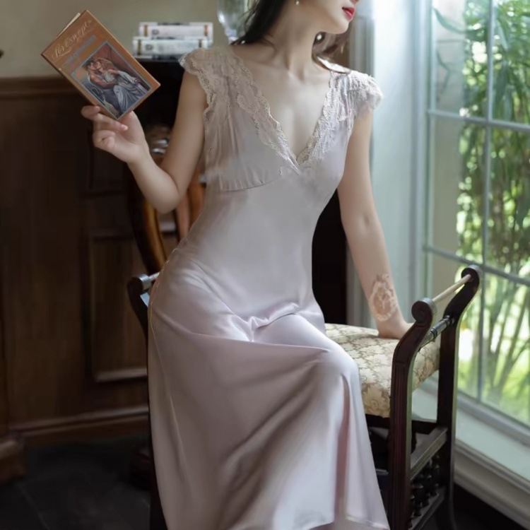 Close-up of ice-silk nightgown fabric showing lustrous sheen and lace detail
