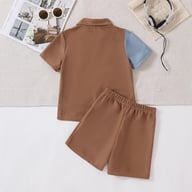 Back view of boy's color-blocked cartoon print shirt and shorts set