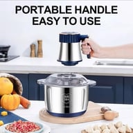 Electric meat grinder with portable handle in modern kitchen setting