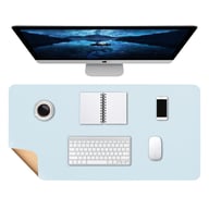 Light blue leather desk mat with monitor, keyboard, and coffee cup workspace