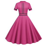 Close-up of pink vintage stand-collar maxi party dress with black trim