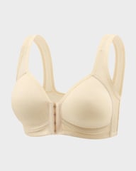 Woman wearing beige front closure wireless bra, medium shot showing comfortable fit