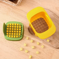 Vegetable chopper with diced and sliced vegetables arranged on cutting board