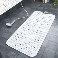 White non-slip bath mat in modern bathroom with strong suction grip
