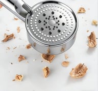 Close-up of self-cleaning silicone nozzles preventing mineral buildup