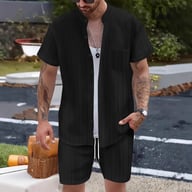 Beige ribbed shirt and shorts set laid flat, styled with accessories