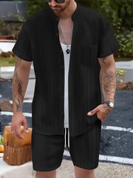 Black ribbed shirt and shorts set on model, close-up texture detail