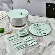 Multifunctional vegetable salad spinner and slicer with interchangeable blade attachments