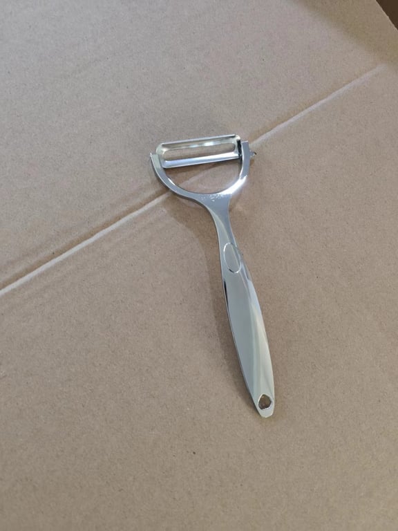 Close-up of ergonomic handle grip on multifunctional peeler