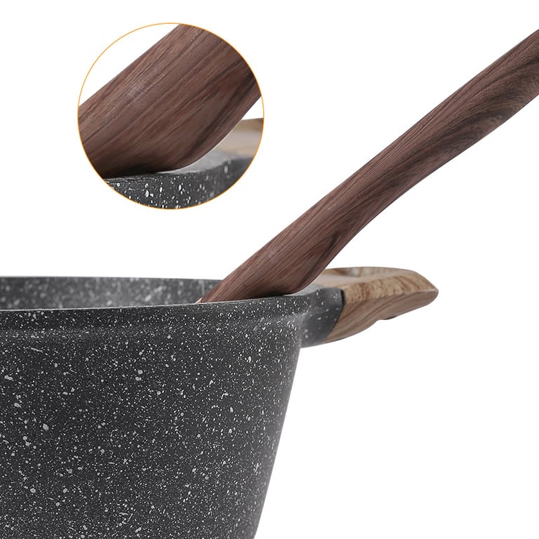 Wood-grain silicone utensil set displayed on modern kitchen counter