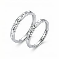 Detailed view of 925 sterling silver wavy diamond accent matching rings pair