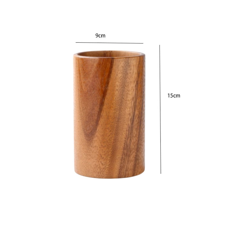 Acacia wood utensil holder with all tools organized and displayed on wooden surface