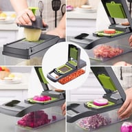 Vegetable chopper in action slicing cucumbers and other fresh produce