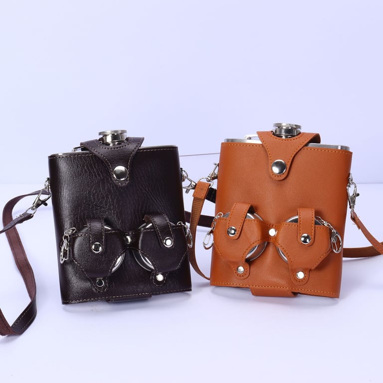 Leather flask sleeve with shoulder strap and metal hardware detail