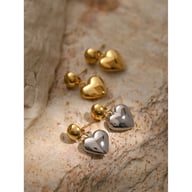 Angled view modern heart studs with polished gold and silver finish
